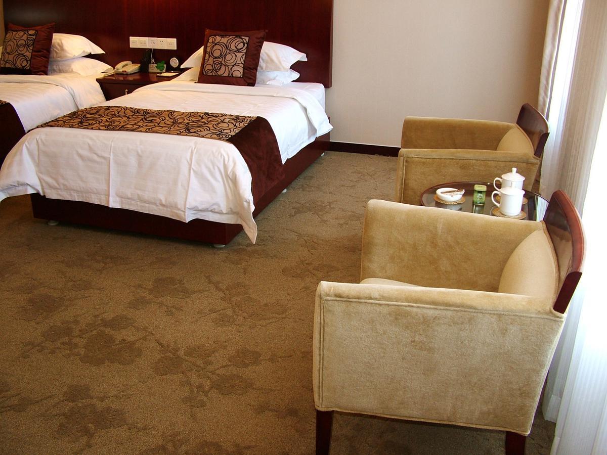 Fuxing Oriental Boutique Hotel Chifeng Room photo